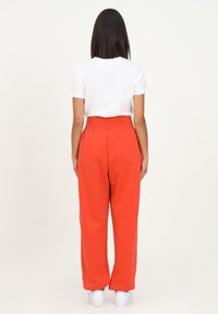 Nike Sportswear W PHNX FLC HR OS - Calças de fato de treino - orange