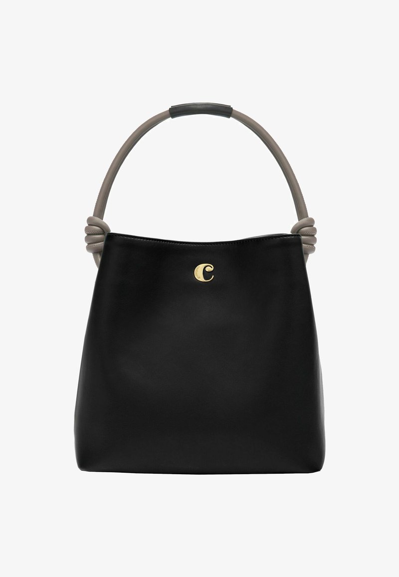 Borsa in pelle nera con manico arrotondato in taupe, decorata con una accentuazione dorata a forma di lettera "C" e un dettaglio annodato alla base del manico.