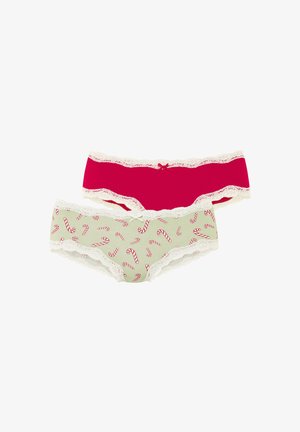 Zwei Damenunterhosen: eine einfarbig rosa mit Spitzenbesatz und eine grün mit Zuckerstangenmuster, beide mit Spitzenrändern.