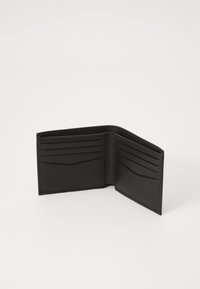Black leather wallet with a textured finish, featuring multiple card slots and a folded design, showcasing clean lines and minimal hardware.