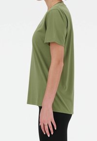 Olive green, short-sleeve T-shirt with a relaxed fit. Made of textured fabric, featuring a round neckline and subtle branding detail.