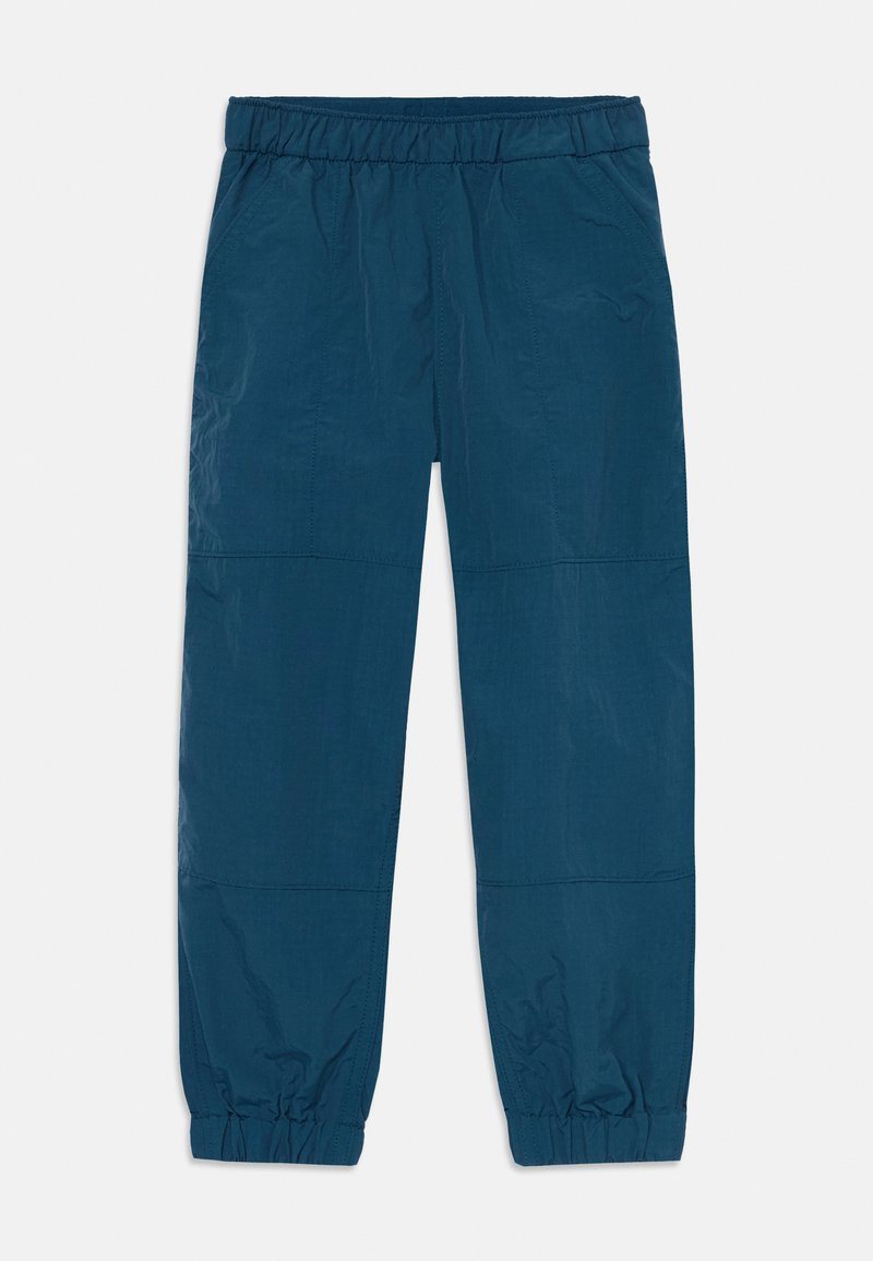 Pantalons légers bleus avec une taille élastique, des poignets fuselés et des détails de panneaux cousus. Fabriqués en tissu doux et froissé.