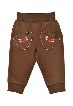 Braune Kleinkinderhosen mit gerippten Bündchen, versehen mit herzförmigen Taschen, die mit Blumenstickereien und Holzknöpfen in Herzform dekoriert sind.