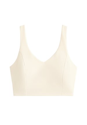 Kremasti teksturirani crop top s širokim naramenicama i dubokim V izrezom, dizajniran za usko pristajanje.