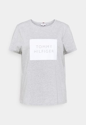 Light grey short-sleeve T-shirt with white square and "TOMMY HILFIGER" text centered on the front.