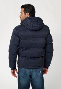 Guess Giacca invernale - blau