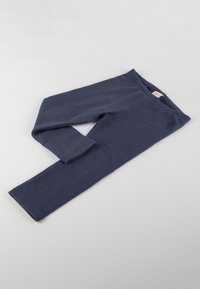 Leggings blu navy realizzati in un tessuto morbido, dotati di una vita elastica, gambe lunghe e una texture liscia senza motivi o decorazioni visibili.