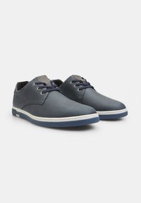 Blue leather shoes with a smooth texture, white stitching, and dark blue rubber soles. Features lace-up design and gray accents on the tongue.