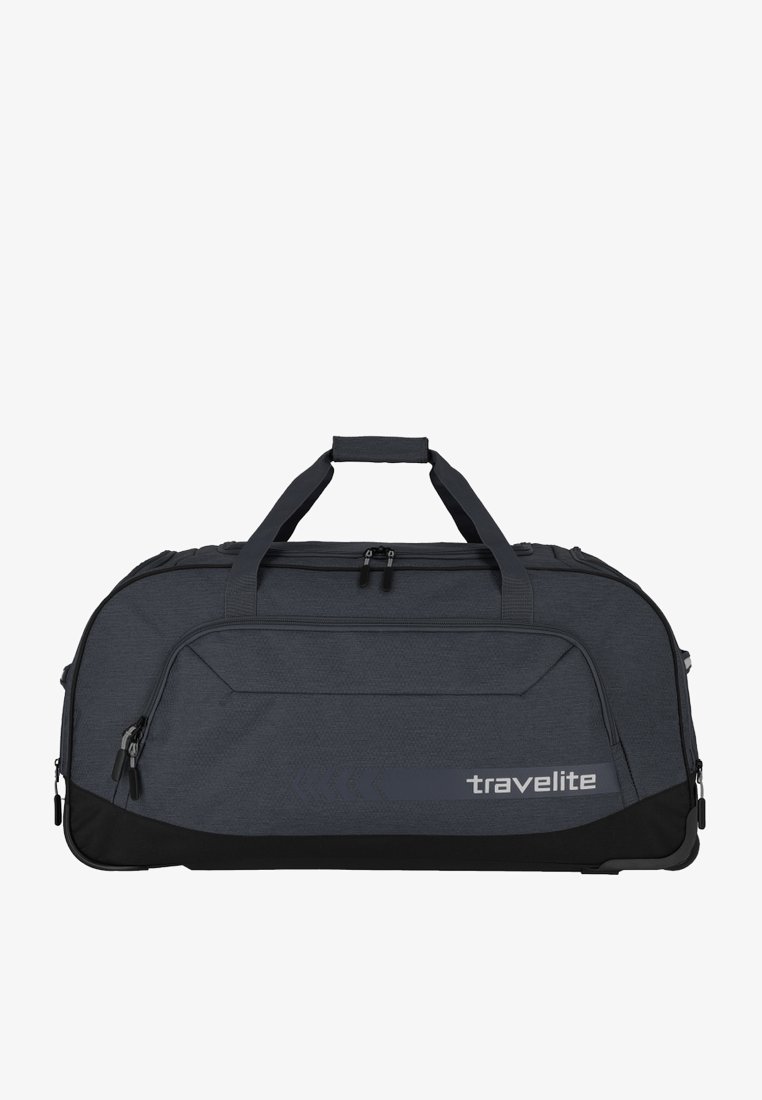 Bolso de lona oscuro con un acabado texturizado, detalles en negro, compartimentos con cremallera y asas dobles para llevar. Presenta la marca "travelite".
