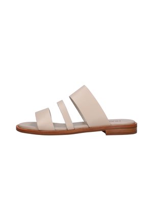Sandalo basso beige con tre ampie fasce e suola marrone, mostrato di profilo su sfondo bianco.