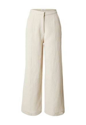 Cremefarbene, weit geschnittene Hose mit hoher Taille und sichtbaren vertikalen Nähten, hergestellt aus strukturiertem Stoff.