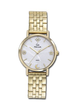 Montre-bracelet en or avec cadran blanc, symboles célestes aux positions 12, 3, 6 et 9 heures, bracelet à maillons en or et mouvement à quartz.