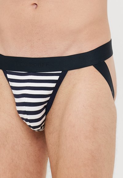 Gestreifter Jockstrap aus Navy- und weißen Stoff mit einem einfarbigen schwarzen Bund. Bietet eine enge Passform und ein Design mit minimaler Abdeckung.