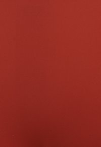 Red stretchy fabric with a ribbed texture, displaying a smooth, uniform surface without patterns or accents.