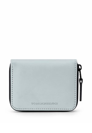Compact light blue zip-around wallet with black zipper pull and UCON ACROBATICS logo embossed on front center.