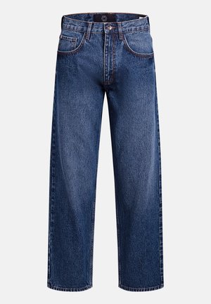 Τζιν με φαρδιά παντελόνια σε σκούρο μπλε χρώμα, με φερμουάρ, πέντε τσέπες και αντίθετη ραφή για επιπλέον λεπτομέρεια και υφή.