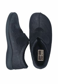 Black fabric slippers with an embossed floral pattern, Velcro strap closure, rounded toe, and textured rubber sole for grip.