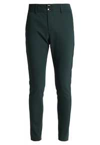 Mörkgröna tights med smal passform, utrustade med två knappar i midjan och en slät yta, designade för komfort och stil.