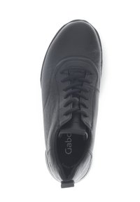 Black leather sneaker with rounded toe, textured surface, and lacing system. Features logo insole and soft padding along the collar.