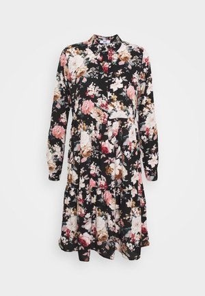 Sort langærmet kjole med rosa, hvidt og brunt blomsterprint, krave og talje med rynkedetalje.