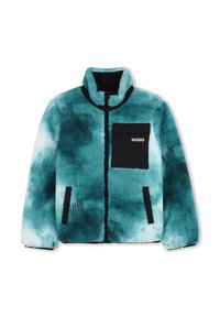 Μπουφάν φλις σε τιρκουάζ με μαύρη τσέπη στο στήθος, φερμουάρ μπροστά και ψηλό γιακά· έχει υφή με ανάγλυφο μοτίβο και αντιθετική μαύρη επένδυση.