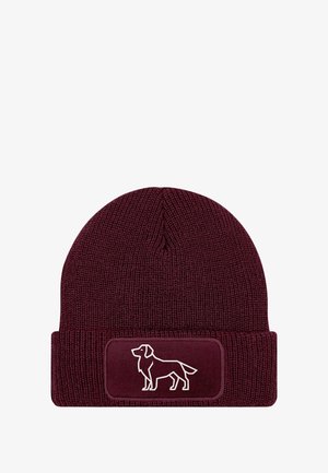 Maroon knit beanie featuring a fold-over cuff and a patch with a white outline of a dog silhouette on the front.