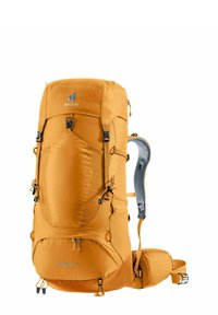 Oranger Wanderrucksack mit verstellbaren Schultergurten, Seitentaschen und verstärktem Boden; verfügt über ein ergonomisches Rückenpaneel und mehrere Schnallen.