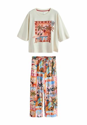 Cremefarbenes Kurzarmshirt mit tropischem Druck und passende bunte tropische Druckhose mit elastischem Bund und Kordelzug.