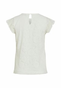Hvid blonde topp med korte flæseærmer, en nøglehulåbning i ryggen og teksturerede blomster mønstre i hele stoffet.