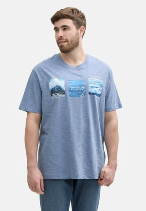 Light blue short-sleeve t-shirt featuring three rectangular water-themed graphics with text accents, made from a soft fabric.