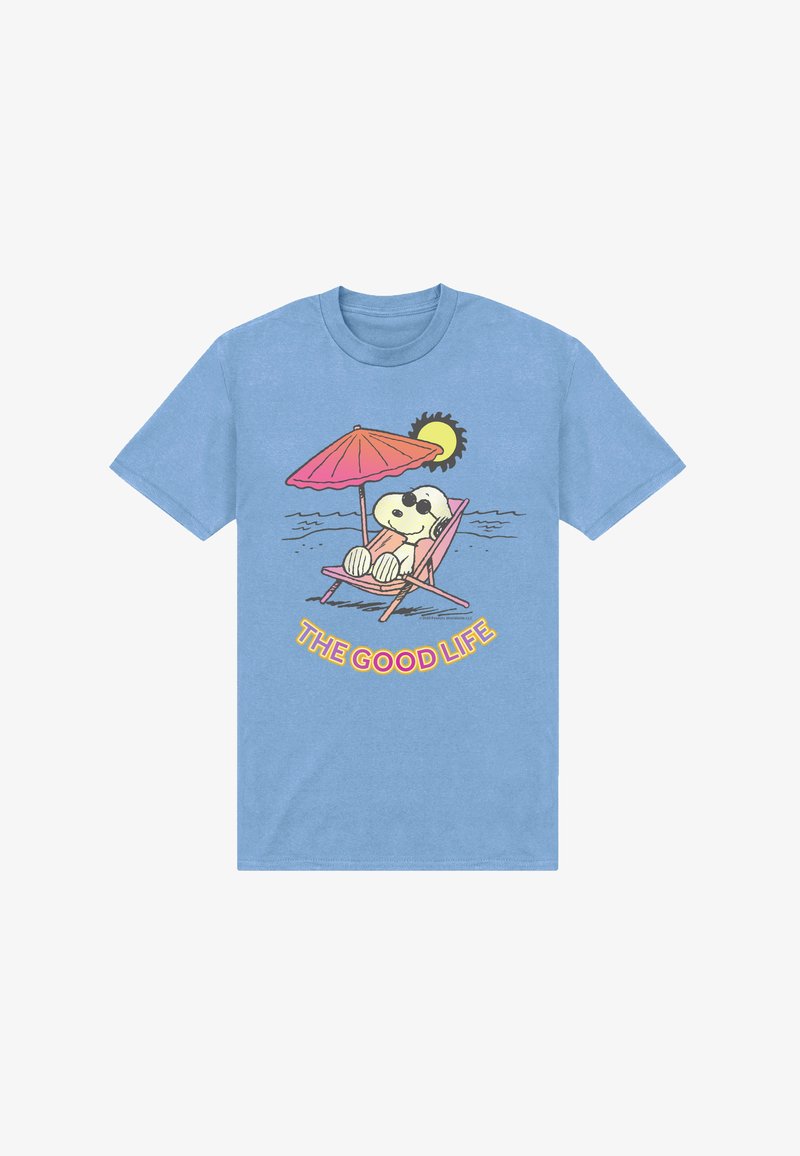 Light blue shirt with cartoon dog relaxing on pink lounge chair under umbrella by water, sun in background, text "THE GOOD LIFE" below.