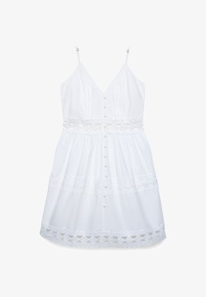 Vestito bianco senza maniche con spalline sottili, bottoni decorativi sulla parte anteriore e intagli in pizzo floreale in vita, gonna e orlo.