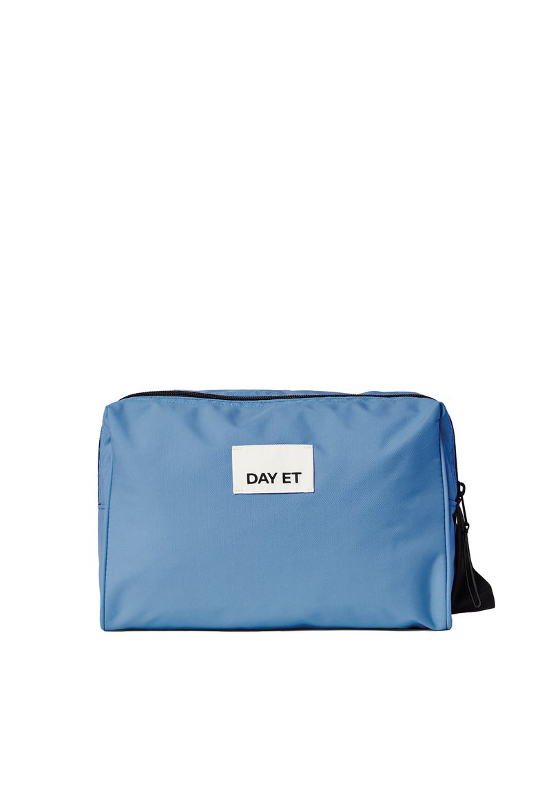 Blue nylon bag with a rectangular shape, featuring a top zipper, black strap, and a white label displaying "DAY ET." Smooth texture.
