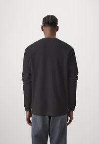 Tommy Jeans Top s dlouhým rukávem - black