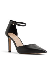 Black leather pointed-toe high heel pump with a slender ankle strap and gold buckle, featuring a smooth finish and beige insole.