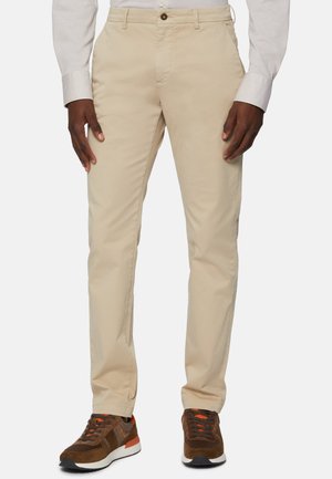 Beige chinos with a straight leg design, made of smooth fabric. Features a button closure, side pockets, and a subtle sheen.