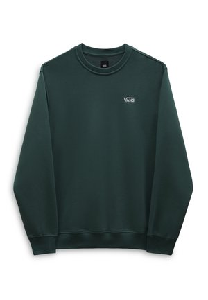 Ciemnozielona bluza z długim rękawem i okrągłym dekoltem, z małym białym logo Vans na lewej stronie klatki piersiowej, przedstawiona na białym tle.