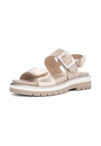 Sandalia beige con puntera abierta, tira ancha ajustable, gran hebilla cuadrada, suela gruesa acolchada y suela exterior texturizada para mayor agarre.