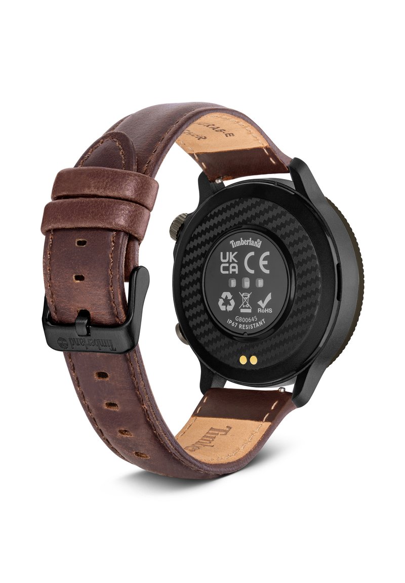Brown leather strap watch with a black carbon fiber back, displaying a circular case, and IP67 water resistance marking.