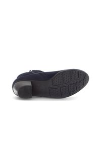 Navy suede ankle boot with a rounded toe, side zipper, and rubber sole featuring a textured tread for traction. Gabor branding on the sole.
