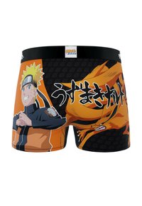 Boxers noirs et oranges avec un graphisme d'un personnage aux cheveux blonds, avec des accents noirs et du texte en japonais.