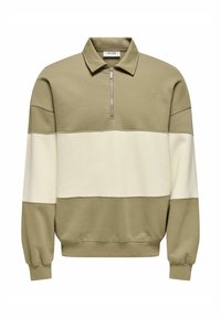 Green and cream pullover sweatshirt with a zippered collar and long sleeves. Features horizontal color blocking and ribbed cuffs and hem.
