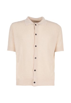 Beżowy krótki sweter zapinany na guziki z prążkowaną fakturą, czarnymi guzikami z przodu i klasycznym kołnierzem.