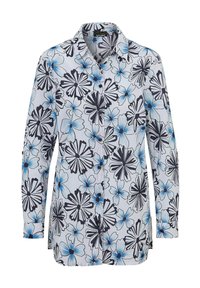Langärmliges Hemd mit Knopfverschluss aus weißem Stoff mit einem blau-schwarzen Blumenmuster, ausgestattet mit einem klassischen Kragen und einem geraden Saum.