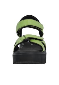 Sandales synthétiques vertes avec deux brides supérieures, design tressé, semelle rembourrée et talon en caoutchouc noir. Taille 37 marqué à l'intérieur.