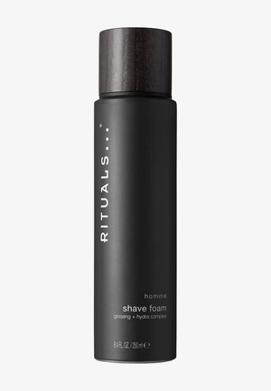 Black cylindrical bottle of shave foam with a dark wooden cap. Label features white text and graphics, highlighting product details and ingredients.