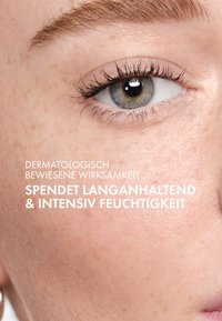 Close-up of a light-skinned eye with long lashes, clear iris, and soft skin texture. Text includes claims about moisturizing efficacy.