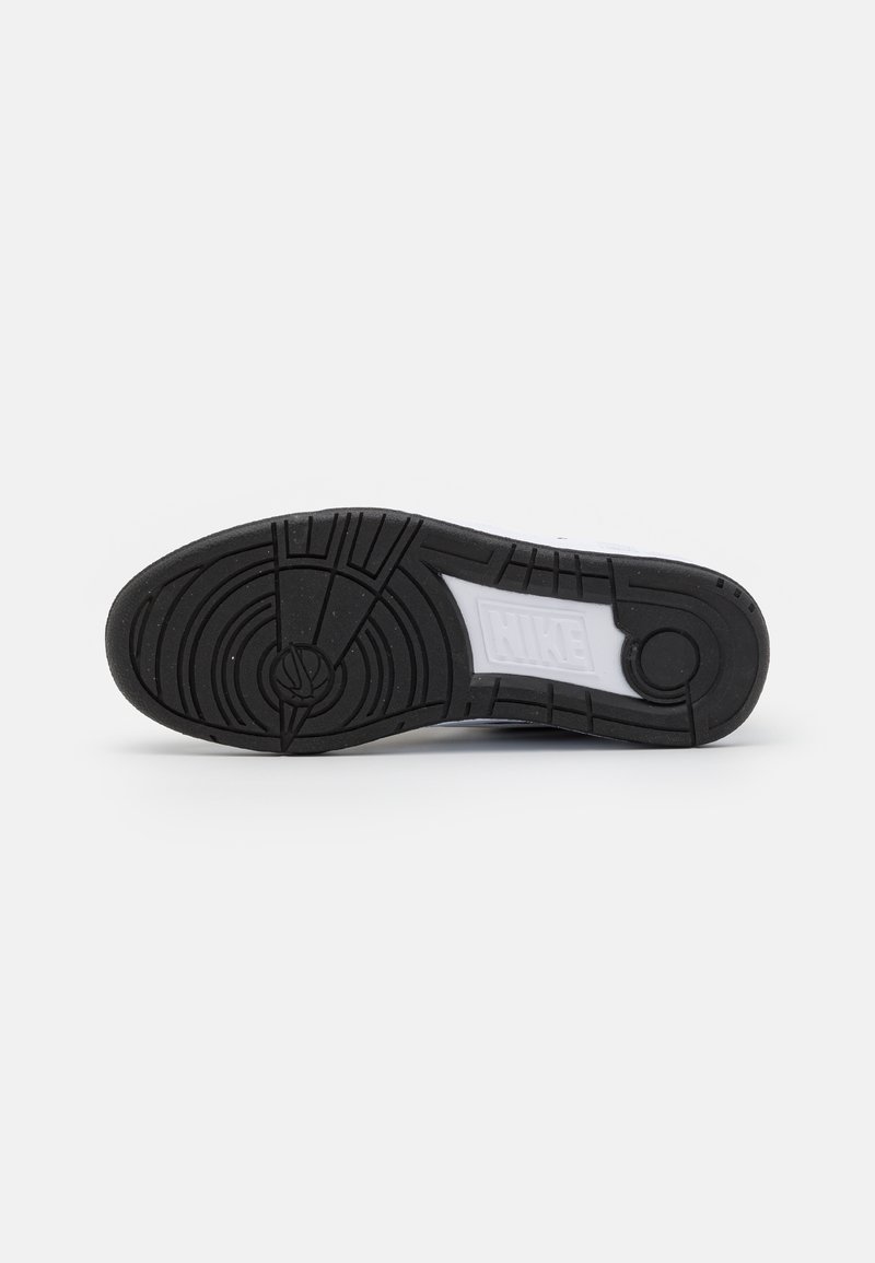 Sole in gomma nera per sneaker con motivo a tondo e dettagli bianchi; presenta un marchio e una superficie texturizzata per una migliore aderenza.