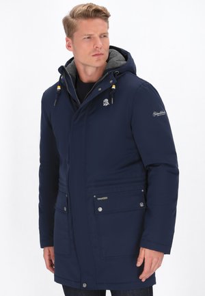 Navy blue insulated jacket with a hood, gray lining, dual zip and snap closure, and two front pockets, featuring logo accents.