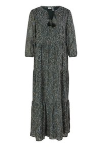Longue robe maxi noire avec motif abstrait à pois blancs, manches 3/4, col en V avec liens à pompons noirs et jupe à étages.